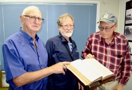 Colin (Central Coast), Ian (Alstonville) and Terry Southwell (Sydney) inspecting the Veness Bible.