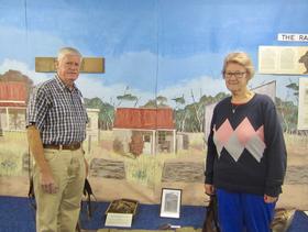 Dick Buitendam and his wife Kerry; between them is Dick's former home in Hall.