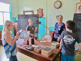 Jenny Butler (nee Bink) about to demonstrate use of the cane.