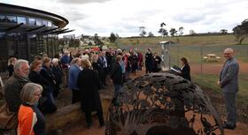 Minister Vassarotti and the assembled crowd at Mulligans Flat Visitor Centre Wildbark for the 2023-2024 Heritage Grants ceremony.